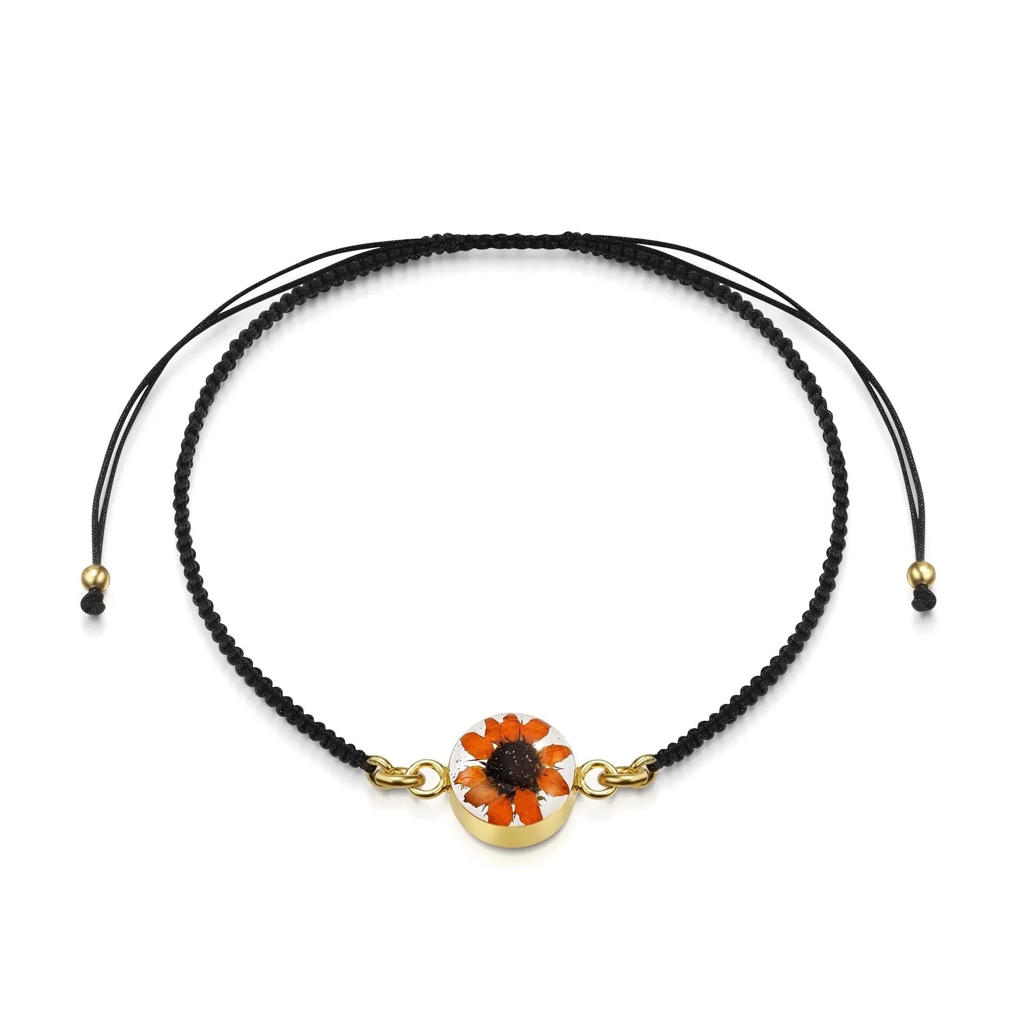 Flower bracelet | Black woven bracelet with gold-plated flower charm by Shrieking Violet®